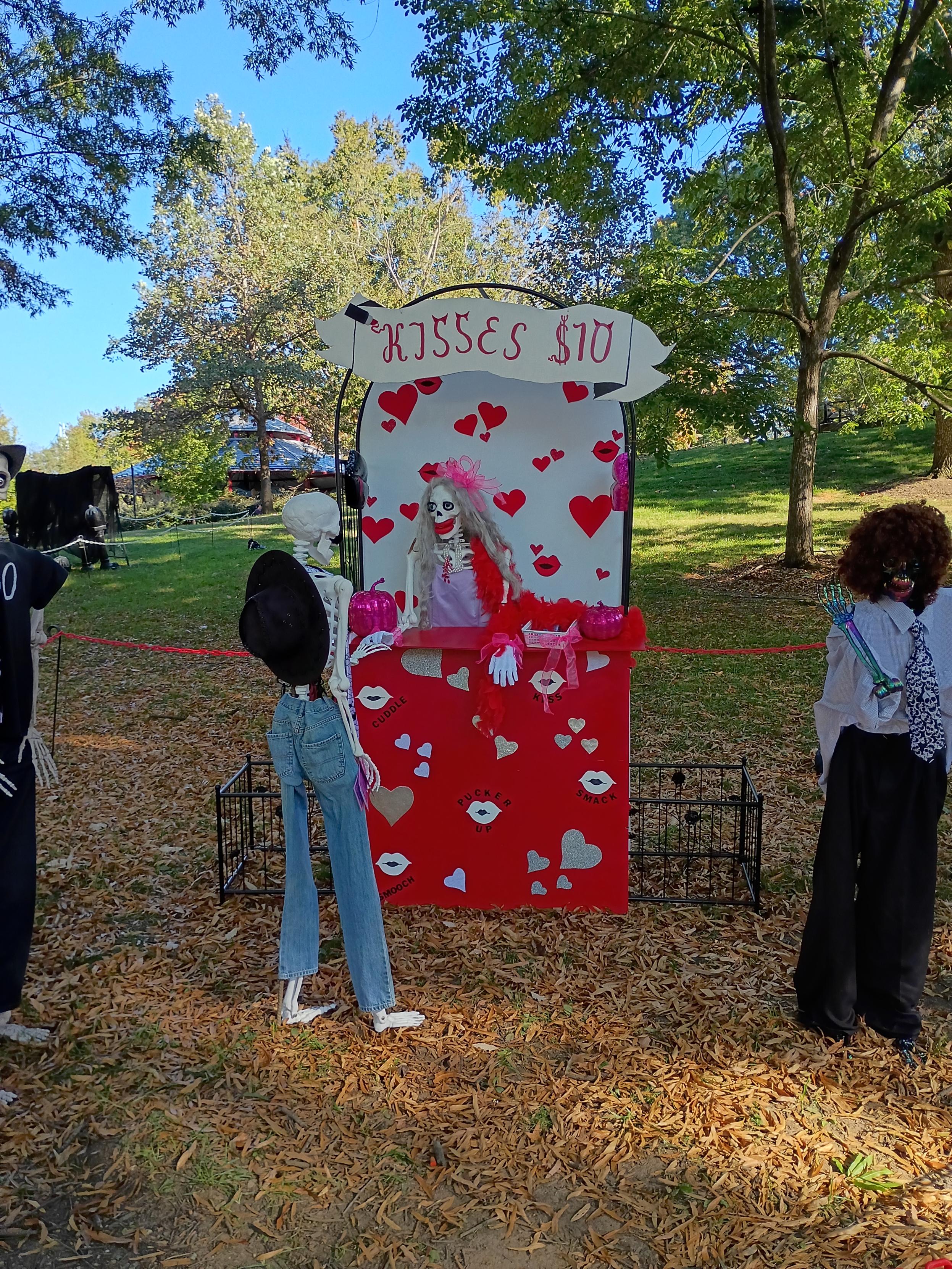 $10 kissing booth with a skeleton in it