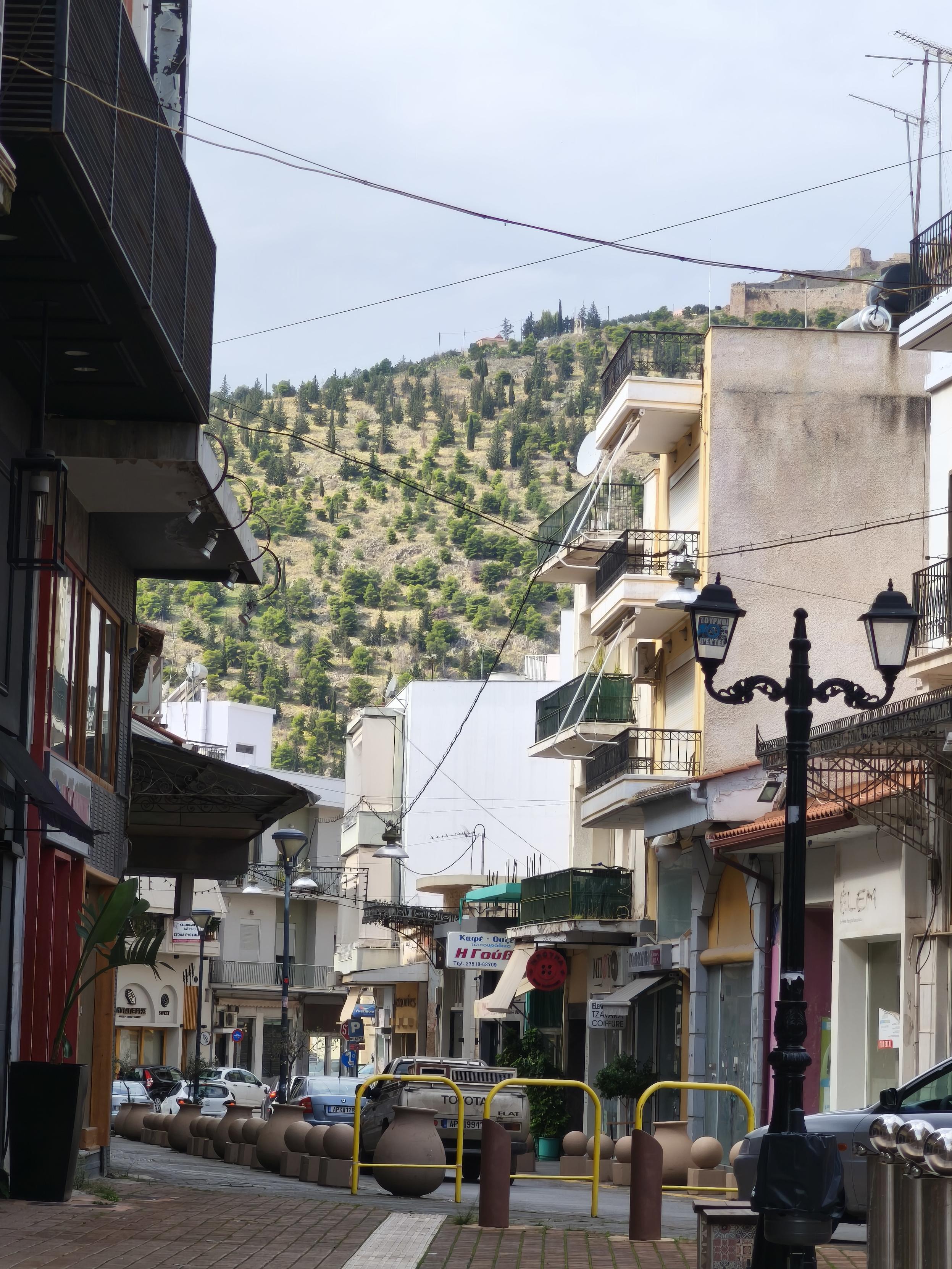 View of the hill Larissa of Argos, photo taken from one of the pedestrian streets in the city centre.