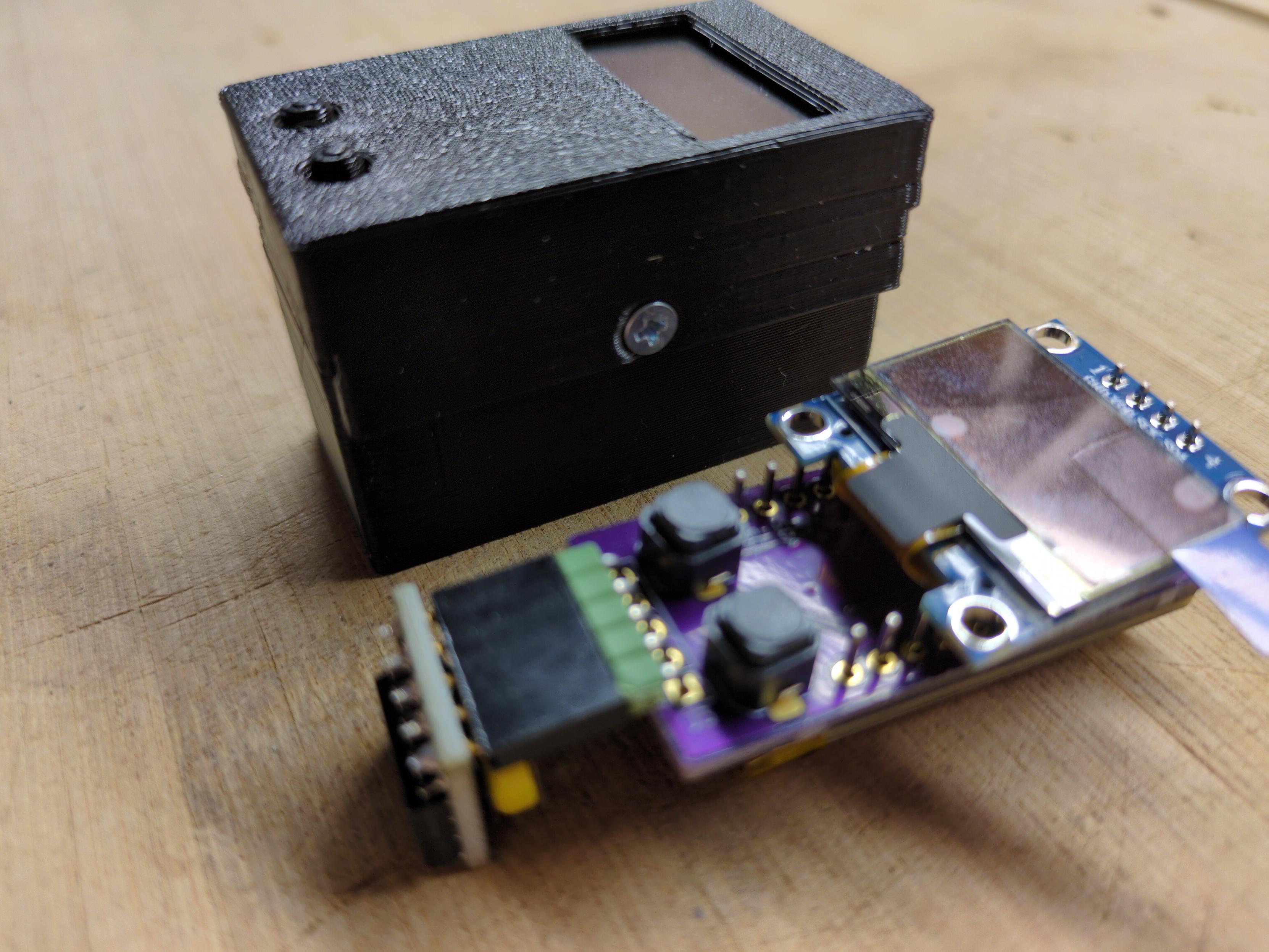 A stack of PCBs with the battery on the bottom and the RTC PCB attached with 90 degree angle headers and a header socket. The risk of shorting the LCD on the USB-C connector is high, but the stacking is at a fixed height. The RTC takes up more space than I'd like, but no desoldering is required.